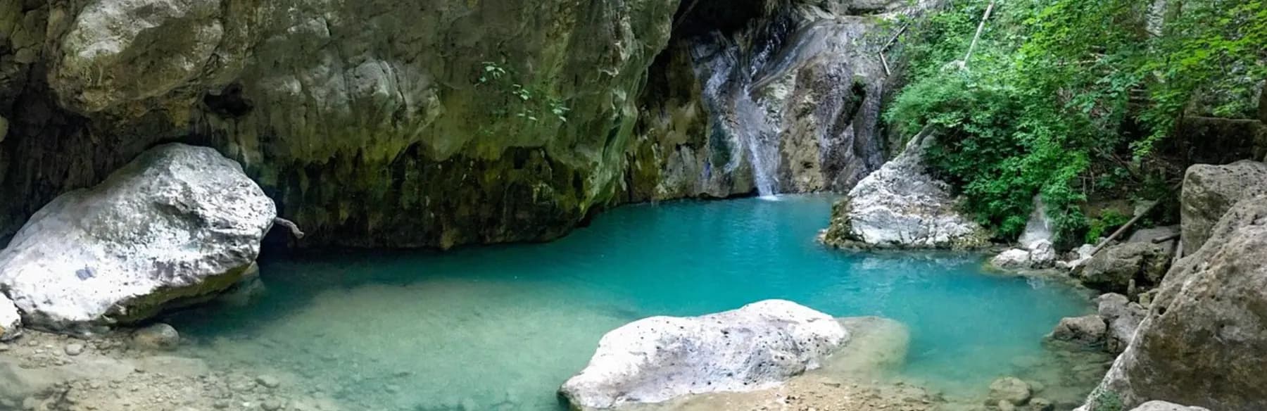 The green Dimosari gorge with boulders and a stream, Lefkada